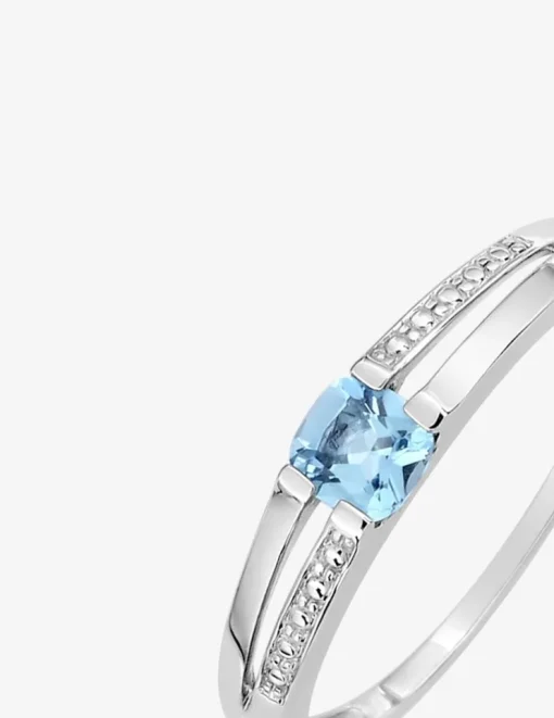 Bague en or blanc 375 ‰ et topaze bleue traitée SO OR