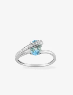 Bague or 750 ‰ blanc avec oxydes de zirconium et topaze bleue SO OR