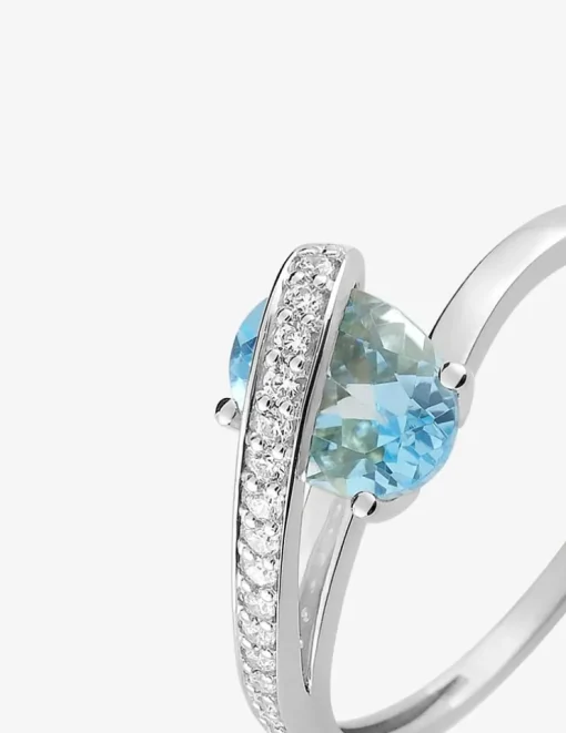Bague or 750 ‰ blanc avec oxydes de zirconium et topaze bleue SO OR