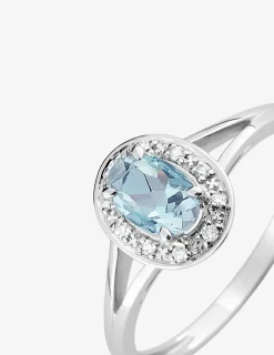 Bague or blanc 750 ‰, topaze et oxydes de zirconium SO OR