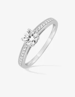 Bague solitaire accompagné or blanc 750 ‰ et oxydes de zirconium sertis griffes et rail SO OR