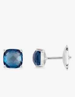Boucles d'oreilles clous or blanc 750 ‰ topaze bleue traitée SO OR