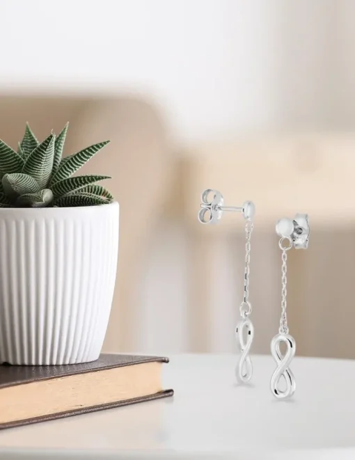 Boucles d'oreilles pendantes or blanc 375‰ motif "infini" SO OR