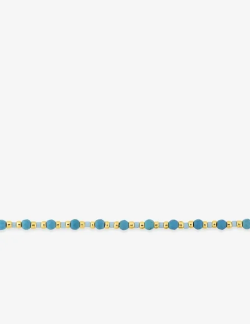 Bracelet en acier doré avec turquoises synthétique et boules de verre bleu SO OR