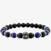 Bracelet en acier gris et autres matières, motif têtes de mort SO OR