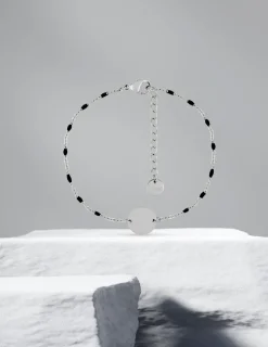 Bracelet fantaisie noir et acier, plaque ronde SO OR