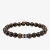 Bracelet élastique bronzite et breloque acier SO OR
