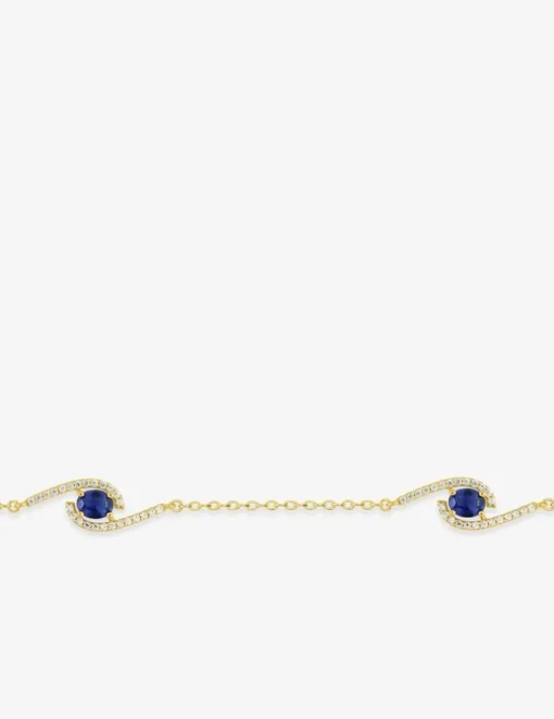 Bracelet plaqué or, rhodium et oxydes de zirconium blancs et bleu foncé SO OR