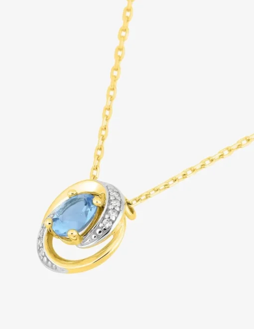 Collier or jaune 375 ‰ rhodium et topaze bleue traitée SO OR