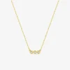 Collier or jaune 750‰ et trilogie oxydes de zirconium SO OR